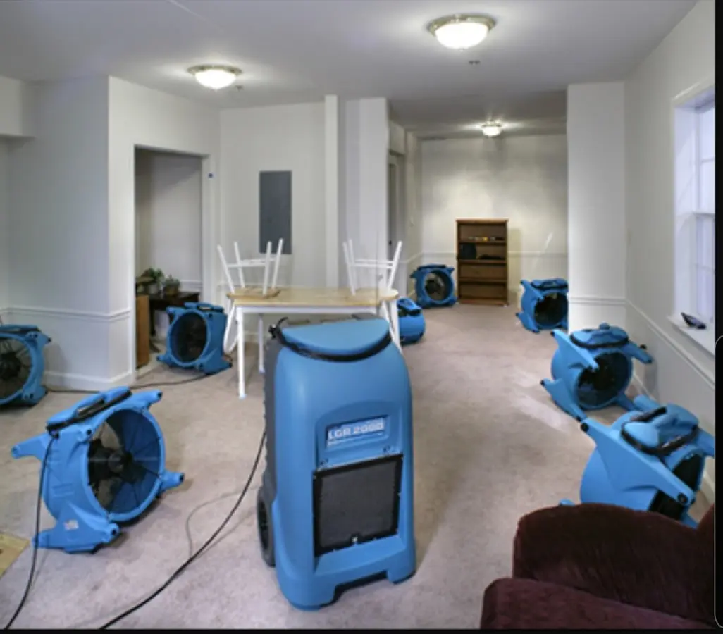Air movers and dehumidifier setup for Water Damage Restoration in Wilton
